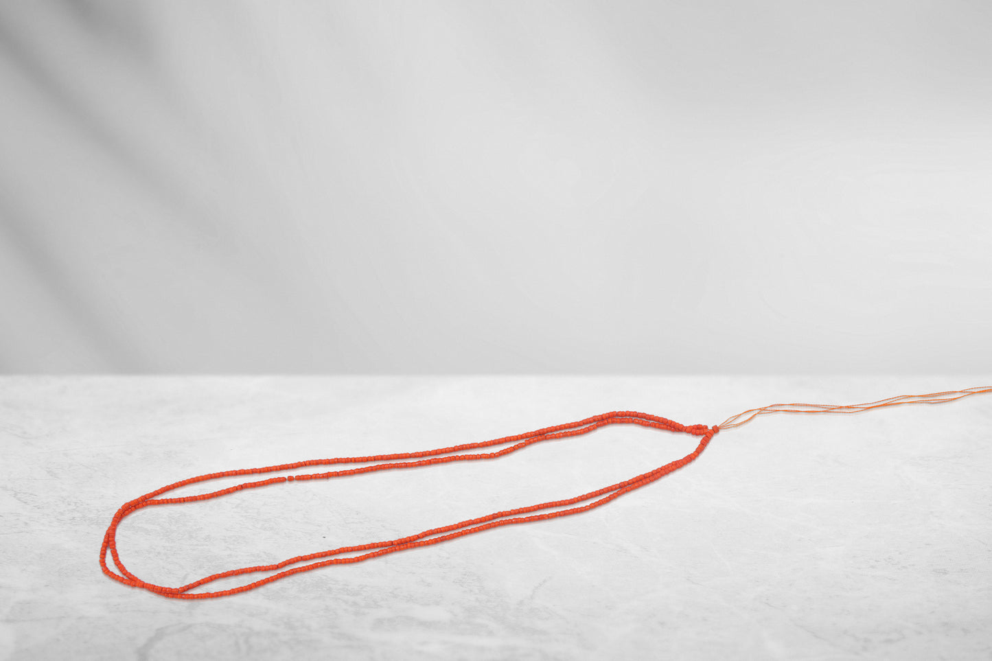 Kanthi (Orange, 11 Inch, 1 mm beads)