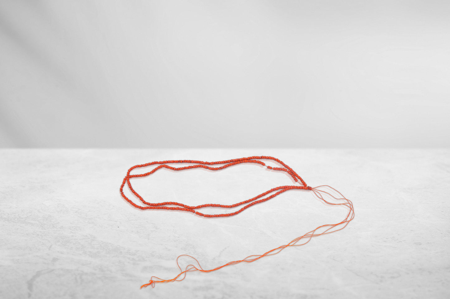 Kanthi (Orange, 8 Inch, 1 mm beads)